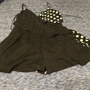 Black and white Sugarlips romper with different size dots.